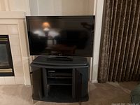 Sony 51 inch flat-screen TV on TV console in living room setting