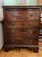 Front view of four-drawer chest