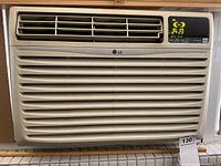 Front view of LG window air conditioner showing vents and logo.