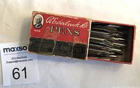 Box of Esterbrook school pen nibs with lid open showing pen nibs inside.