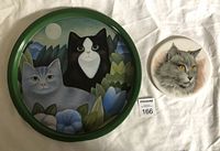 Round metal tray with green rim and cat artwork by Martin Leman.