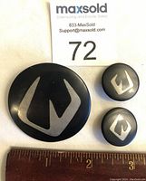 Full set of Hans Hansen modernist brooch and clip-on earrings shown with ruler for size reference.