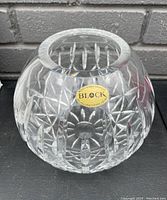 Top view of the clear crystal vase showing the mouth opening and detailed cut patterns around the sides with Block label sticker.