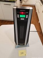 Front view of the heater showing digital display and control buttons with the unit plugged in and operating.