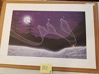 Full view of the limited edition print depicting wolves howling at the moon with a white rock at the bottom.