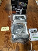 New, unused Braun BrewSense coffee maker in plastic packaging with user manual, shown alongside product box.