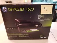 Front view of the original sealed box with HP Officejet 4620 branding and image of the printer.