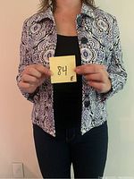 Front view of the Jones New York paisley blazer jacket worn by a model holding a sticky note with '84' handwritten on it.