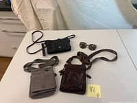 All items displayed together, including three bags and one pair of sunglasses