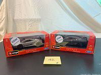 Two boxed Lamborghini car models side by side in their original Bburago packaging.