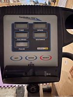 Digital console showing CardioMax 835 branding; LCD fields for time, speed, calories, distance and pulse; Set, Mode and Reset buttons