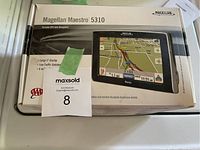 Photo of the original box of the Magellan Maestro 5310 GPS unit showing front packaging with device image and model details.