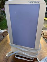 Photo of Verilux Happy Light therapy lamp with power cord wrapped around base