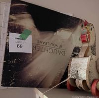 Image showing the Pink Floyd The Wall double album and the Daughter album titled 'If You Leave' covers, along with the wooden pull toy hen.