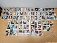 Full layout of 60 Superman 1978 trading cards from the complete set in plastic sleeves