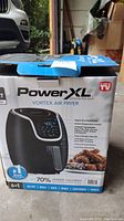 Closed box of Power XL Vortex Air Fryer, with brand and model details visible on front and side.