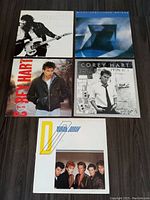 Five vintage vinyl LPs laid out on floor including two Corey Hart albums, a Duran Duran album, and two others with abstract/artistic covers.