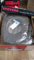 Stetson cowboy hat inside original box with Stetson branding on the box.