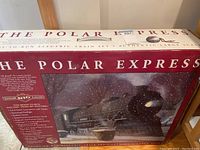 Photo of original box top with The Polar Express title and large scale train illustration.