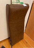 Front and back views of the brown Wahl electric back massager with controller attached, showing size and overall condition.