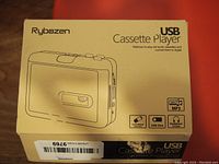 Box of Rybozen USB Cassette Player showing brand, model and functions including cassette to MP3 conversion