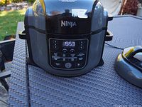 Front view of the Ninja Foodi XL with digital display panel and controls.