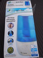 Photo of the humidifier box showing product features such as 70-hour operation, 1.0 gallon tank, aroma diffuser, and silver clean protection.