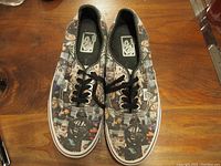 Top view of Vans sneakers displaying the full Star Wars character print and black laces.