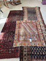 Photo showing all three rugs side-by-side on floor, depicting their size differences and designs.