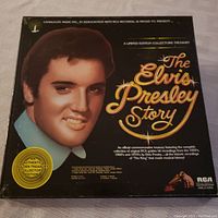 The outer box cover showing a portrait of Elvis Presley with title 'The Elvis Presley Story' and limited edition collector's labeling.