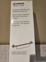 Box for Moen designer grab bar with integrated towel bar highlighting product name and features in multiple languages