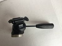 Manfrotto 390 RC tripod head in black with handle, mounted on a white background.