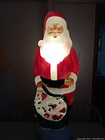 Full front view of Santa Claus blow mold figure illuminated from inside.