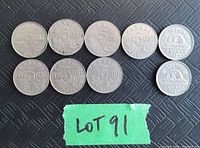 Eight Canadian 5 cent coins on a black textured background with a green tape labeled 'LOT 91'.