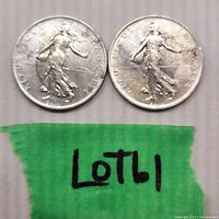 Two 1969 French 1 Franc coins placed side by side showing front design with 'Sower' figure and inscription 'REPUBLIQUE FRANÇAISE'.