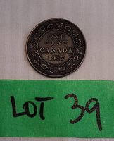 Front side of the 1917 Canadian one cent coin showing the date and maple leaf design.