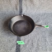 Top view of the 8-inch Lodge cast iron frying pan showing the cooking surface and pouring spouts.