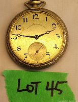 Front dial view showing black numerals and subsecond dial at 6 o'clock, Robert Donald Ltd label visible, surface has wear and spots. Missing crystal.