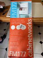 Photo of Cabinetworks FM177 bathroom cabinet packaging box showing product features and dimensions.