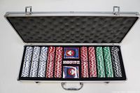 Open aluminum carrying case showing organized poker chips in white, red, green, and black colors along with two decks of playing cards and dice inside the case.