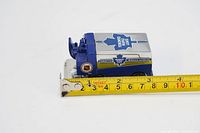 Top and side view of die cast metal mini Zamboni with tape measure showing length approx 6.5 cm
