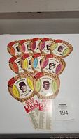 Photo showing eleven die cut baseball cards arranged with visible colorful outlines and player images central to each.