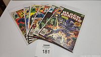 Seven Black Panther comics displayed side by side showing cover art and condition.