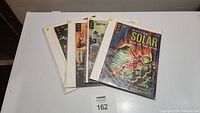 Four Doctor Solar Gold Key comics from 1964-1967 shown together, bagged and boarded.