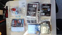 Overview of new Ultra Pro and BCW card protection products including card sleeves and top loaders in original packaging.