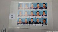 Front view of the uncut sheet showing headshots of Edmonton Oilers players and staff in hockey card format.