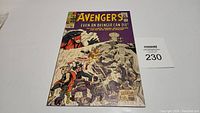 Front cover of The Avengers #14 comic book showing superheroes in action, mainly Thor and Iron Man, with clear issue number and date.