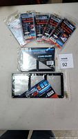 Photo of five Ultra Pro single card screwdown holders unopened in original packaging, along with one 2-card holder and one 3-card holder.