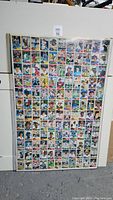 Photo of a large uncut sheet containing 132 baseball cards from the 1981 OPC series, arranged in a grid and displayed upright.
