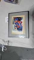 Framed photo of Wayne Gretzky in Edmonton Oilers hockey gear, signed with autograph on front.